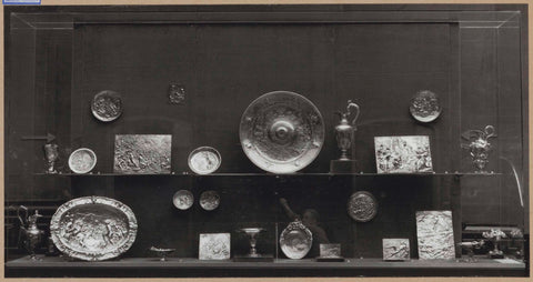 Display case with silver objects, including a bowl, jugs and plaques, c. 1959 Canvas Print