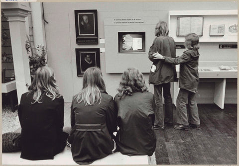 Visitors watch a video production in a room with various objects, c. 1975 Canvas Print