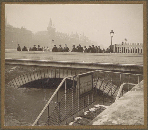 People watch from a bridge the high water level in the Seine at the flood of Paris, G. Dangereux, 1910 Canvas Print