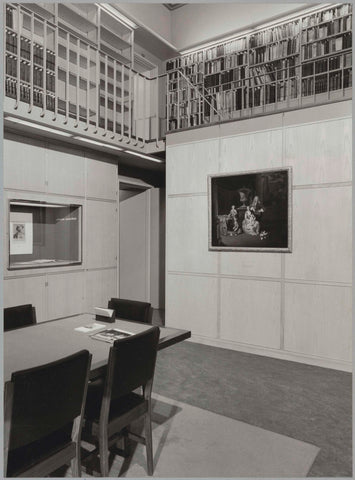 Space with staircase, gallery, bookcases, acquisitions display, table, chairs and family portrait, 1983 Canvas Print