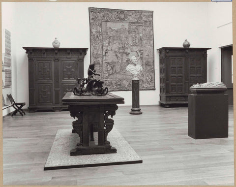 Room with furniture including cupboards and a table, a bust and a tapestry, 1962 Canvas Print