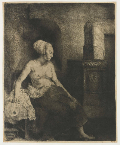 Woman sitting half dressed beside a stove, Rembrandt van Rijn, 1658 Canvas Print