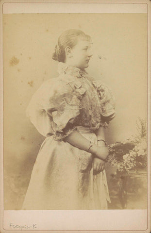 Portrait of Princess Wilhelmina as a Girl, Standing with a bouquet in hand, anonymous, c. 1895 - c. 1896 Canvas Print