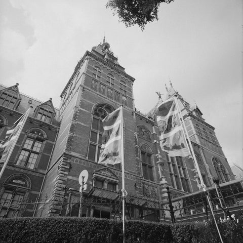 North façade with three flags in front of a fence, c. 1985 Canvas Print