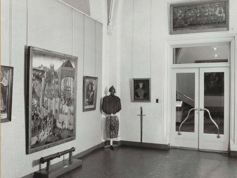 Corner of room 101 with armor, paintings and a sword, 1963 Canvas Print