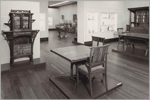 Room with furniture including chairs, a table, a cupboard with (presumably) ceramics and a passageway with a view of furniture, 1983 Canvas Print