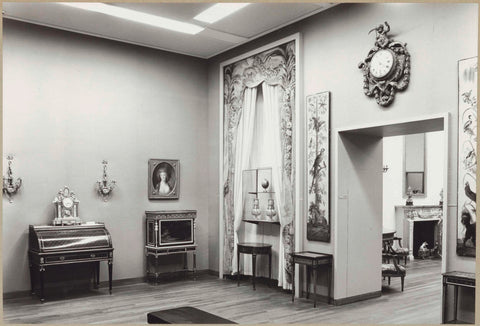 Room with furniture including a secretarial and tables, draped textiles, clocks and a passageway with panels with plant and animal motifs on both sides, 1964 Canvas Print