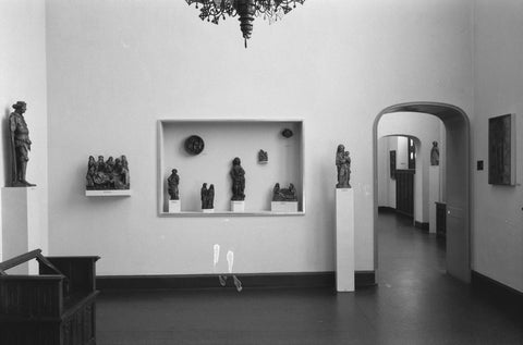 Room with statues on pedestals and in display case and passage, 1953 Canvas Print