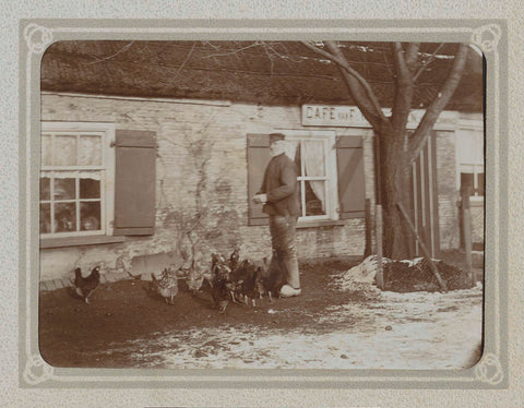 Man feeds chickens in front of a café, Folkert Idzes de Jong, c. 1905 - c. 1907 Canvas Print