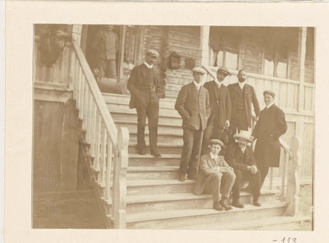 Portrait of a group of travel companions of Dolph Kessler on the stairs in front of a wooden house, Geldolph Adriaan Kessler, c. 1903 - 1908 Canvas Print