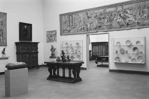 Room with furniture including cabinets, display cases, statues, tapestry and passageway, 1952 Canvas Print