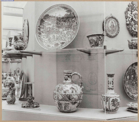 Display case with ceramic objects, including a jug, a vase and a bowl, c. 1959 Canvas Print