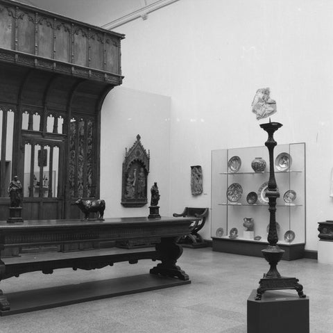 Room with display case with various objects, table, candlestick and an ochre, c. 1959 Canvas Print