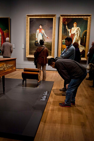 Visitor reads the text board of a wing in empire style, in the background the portraits of Louis Napoleon (1778-1846) and Emperor Napoleon I in the room Waterloo and King William I: 1800-1900, 2013 Canvas Print