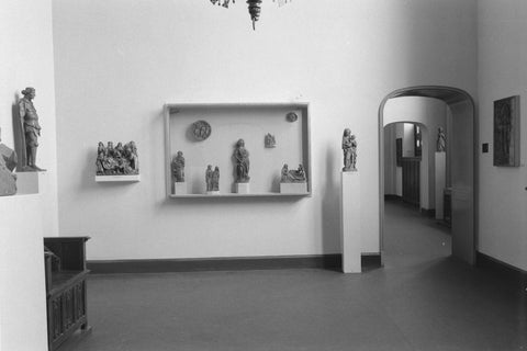 Room with sculptures, partly in display case, and a passage, 1952 Canvas Print