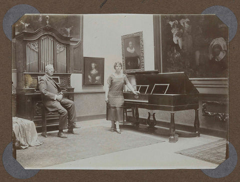 Two persons pose in a hall with musical instruments in 1925., 1925 Canvas Print