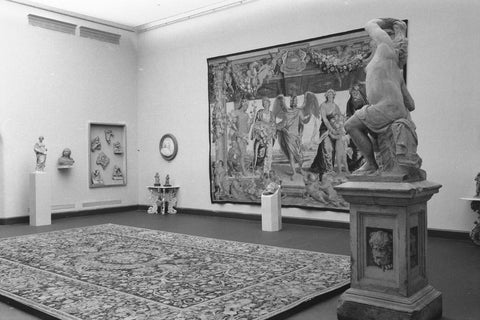 Room with statue, display case, floor and tapestry, 1952 Canvas Print