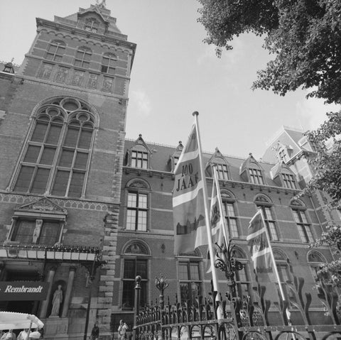 North façade with three flags behind a fence, c. 1985 Canvas Print