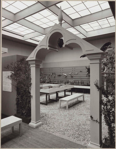 Gate of the reconstructed Ambulacrum of the Hortus with a view of plants, stuffed animals, display cases with books and a bench for visitors, c. 1975 Canvas Print