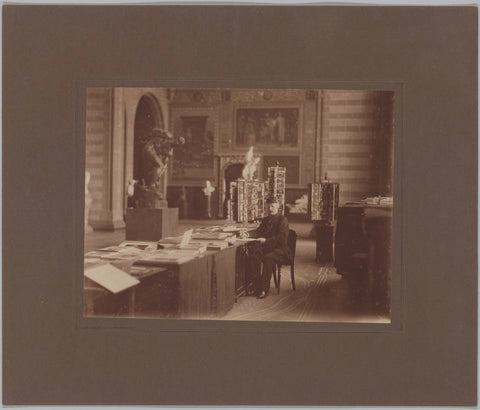 Mr. Hartman sitting at an office at the reproduction sale in the Voorhal, c. 1920 Canvas Print