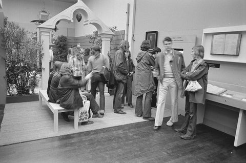 Visitors in a room with in the background the entrance gate of the reconstructed Ambulacrum of the Hortus, c. 1975 Canvas Print