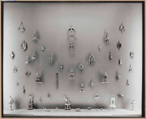 Display case with various metal objects including jewelry, c. 1959 Canvas Print