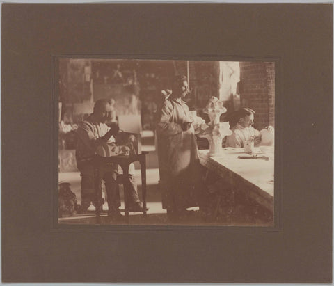 Three men including Jean Janssens (left) in the plaster workshop, c. 1920 Canvas Print