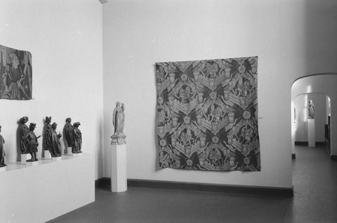 Room with arrangement of Medieval arts and crafts: statue on pedestal, tapestry, pleurants and passage, 1952 Canvas Print