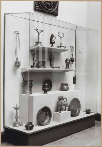 Display case with various objects including candlesticks, censers and a lion figure, c. 1959 Canvas Print