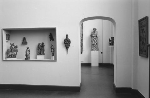 Room with statues in display case and passage with view on picture, 1953 Canvas Print