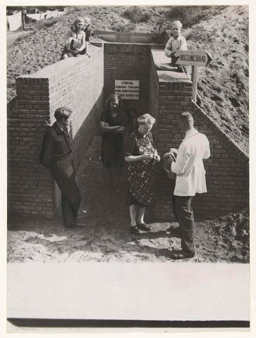 Men, women and children at the entrance of a bomb shelter in Nijmegen, Associated Correspondents, 1946 Canvas Print