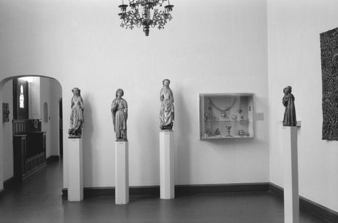 Room with statues on pedestals, display case and passageway, 1953 Canvas Print