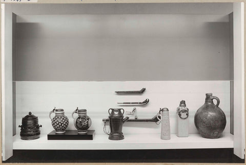 Display case with various objects including jugs, 1971 Canvas Print