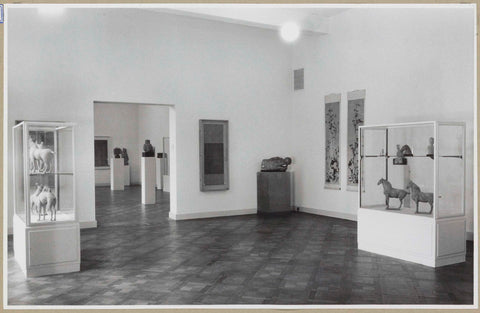 Room with two display cabinets with horses, camels and other figurines, on the left a view to another room, 1952 Canvas Print