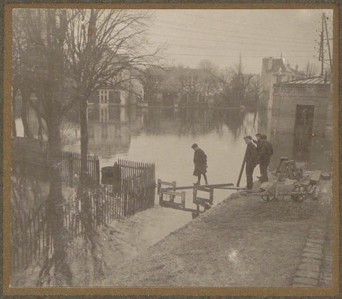 Boys build a bridge in flooded land in a suburb of Paris, G. Dangereux, 1910 Canvas Print