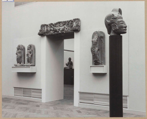 Hall with five sculptures including a head of Sukuh on the right, a passageway in the middle, 1961 Canvas Print