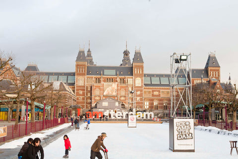 South façade seen from the Museumplein, in the foreground a frozen pond with skating children, 2012 Canvas Print