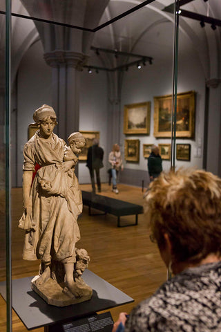 Woman looks at the sculpture Two mothers by Frans Stracké in the room 1800-1900 The Hague School / Amsterdam Impressionists, 2013 Canvas Print