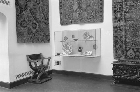 Room with wall carpets, display case and chair, 1953 Canvas Print