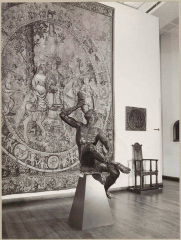 Corner of a room with statue ofTriton in front of a tapestry flanked by armchairs, c. 1977 - c. 1999 Canvas Print