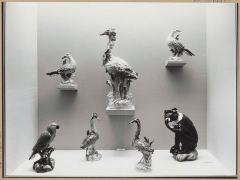 Showcase with seven sculptures of Meissen porcelain: six birds, a monkey, 1962 Canvas Print