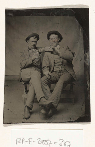 Portrait of two men, one of whom pours the other drink from a bottle in a glass, anonymous, c. 1870 - c. 1900 Canvas Print