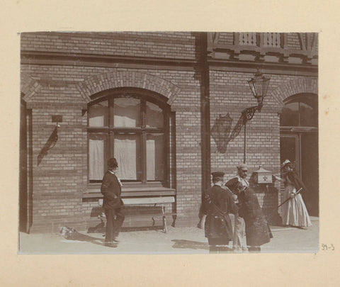 Persons including, presumably train or boat conductors, in front of a building, Hendrik Herman van den Berg, in or after 1890 - in or before 1894 Canvas Print