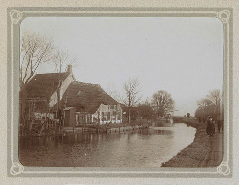 Farm overlooking a water and a road with people, Folkert Idzes de Jong, c. 1905 - c. 1907 Canvas Print