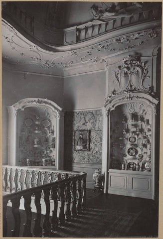 Corner of room with two display cabinets with Chinese porcelain, in between hang a portrait, c. 1920 - c. 1950 Canvas Print