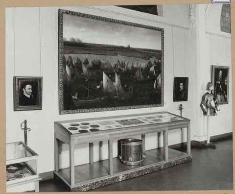 Painting with ships between two portraits hanging above a laying display case, 1963 Canvas Print